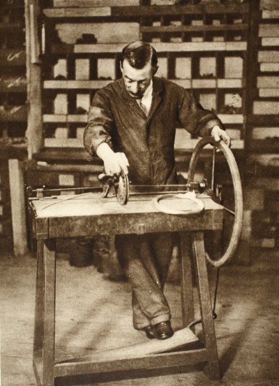 Locksmith winding wire into springs, from Wonderful London, published 1926-27 by English Photographer